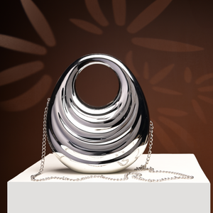 Radiant Silver Metallic sculpted Handbag.